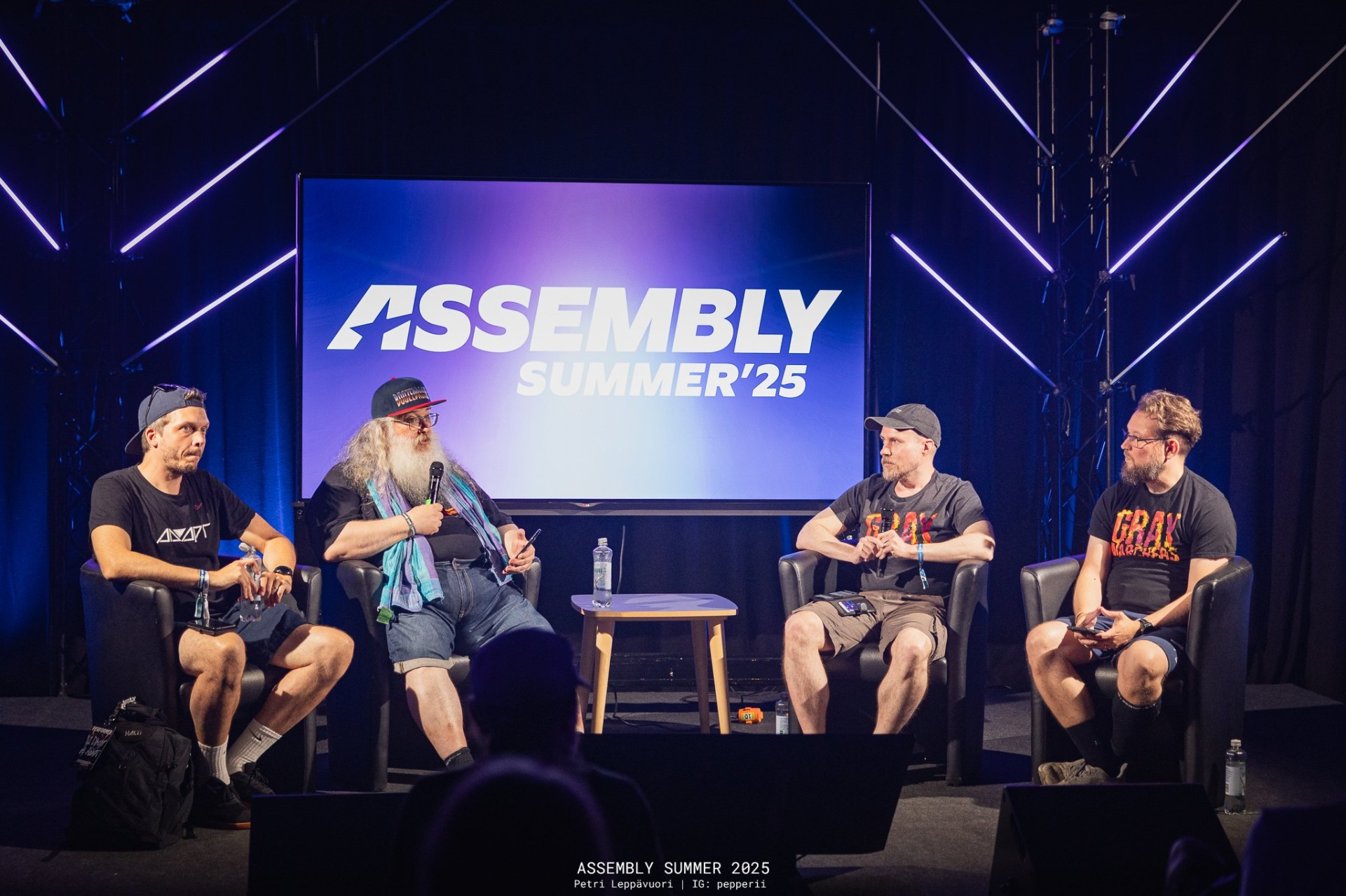Panel discussion on stage in front of the Assembly Summer '25 logo
